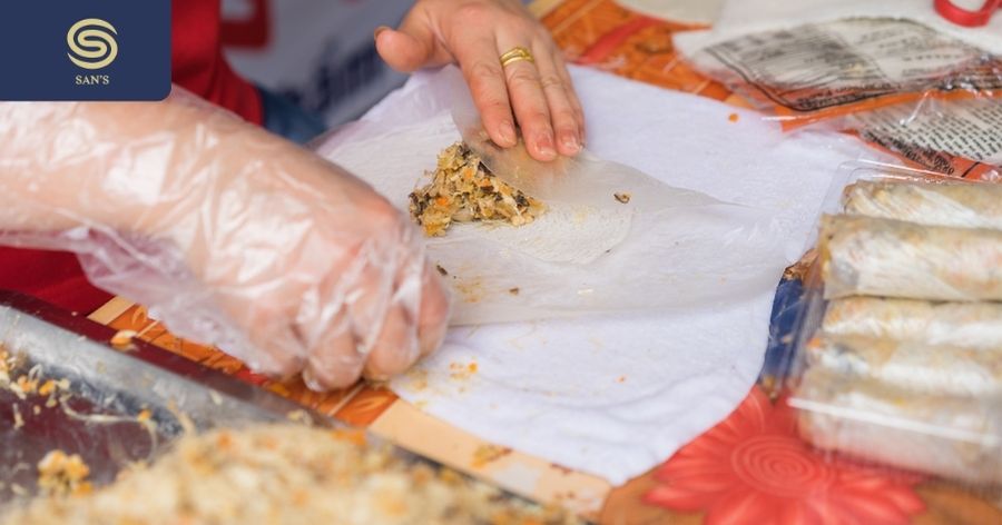 Making fried spring rolls at Miss Hanoi Cooking Class